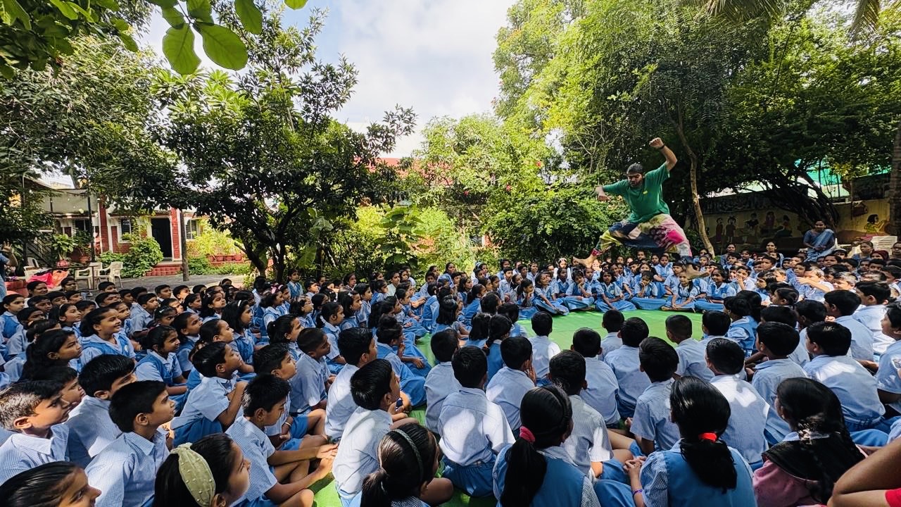 About page hero — wide campus shot or founders