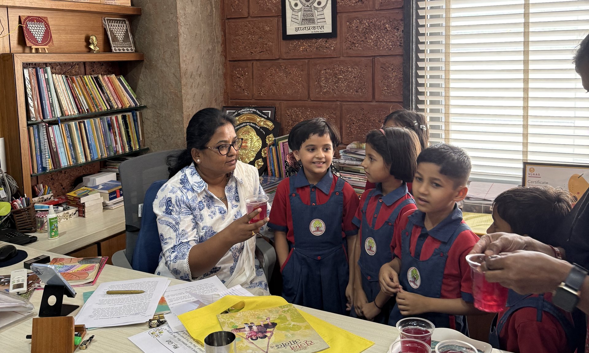 Principal's Note — Savita Narhare with the Dnyanprakash community